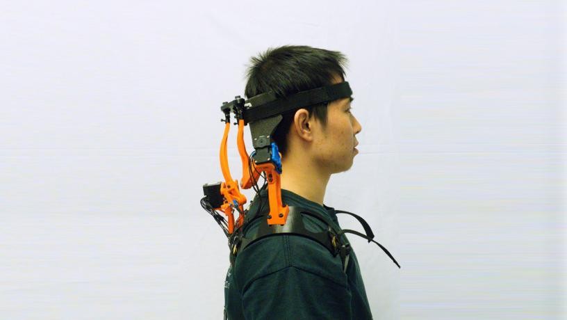 The robotic neck brace worn by a human subject