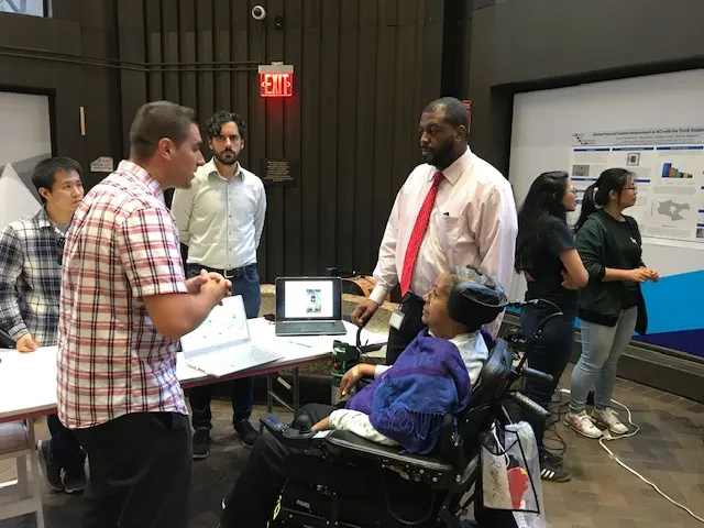 ROAR members talking to a patient