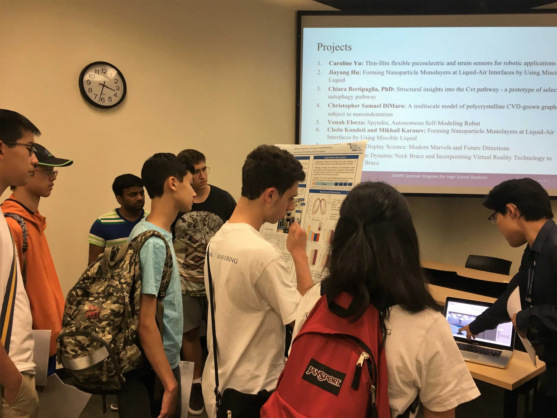 Undergraduate researchers presenting